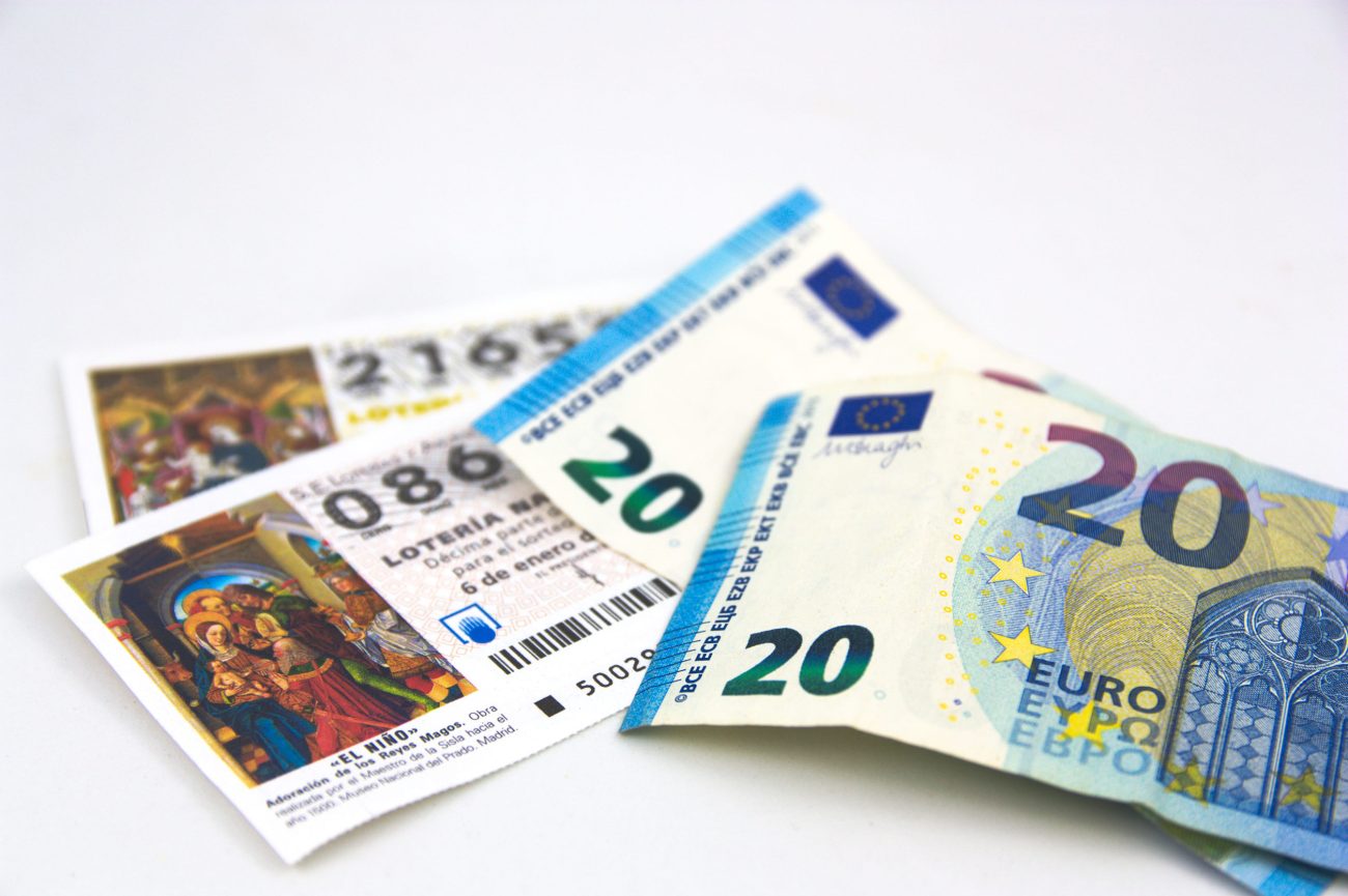 Euro banknotes (20 and 50) fanned out on a white background.